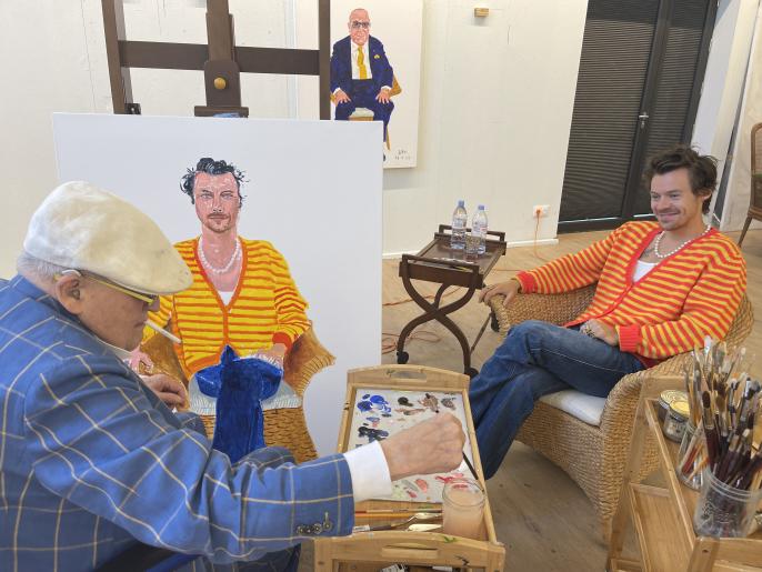 David Hockney painting a portrait of Harry Styles in his studio