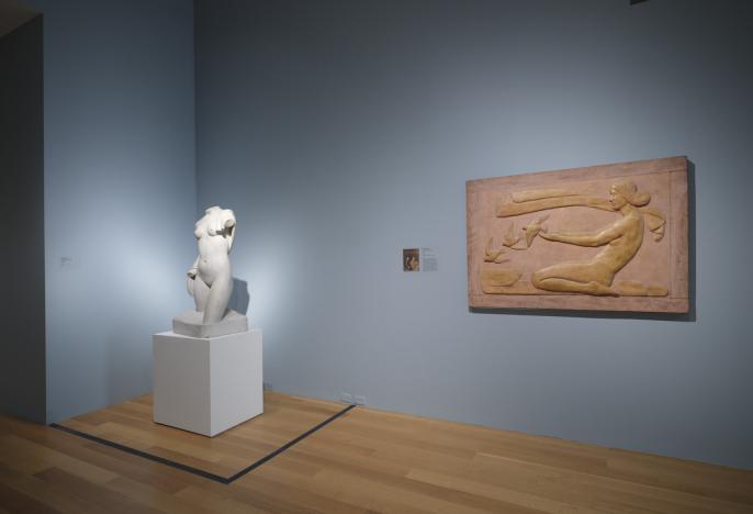 Installation view of Florence Wyle's Draped Torso and Frances Norma Loring's Dawn. The sculptures are installed beside each other