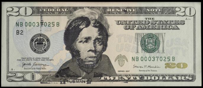 U.S. 20 dollar bill overstamped in black ink with an image of Harriet Tubman