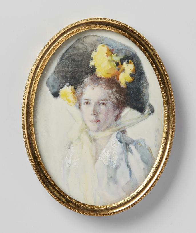 This miniature watercolour portrait on ivory by Mary Wrinch features a women sitter from the chest upwards. She is wearing a light blue top and a large black hat with yellow flowers. The hat is tied to her chin with a yellow ribbon