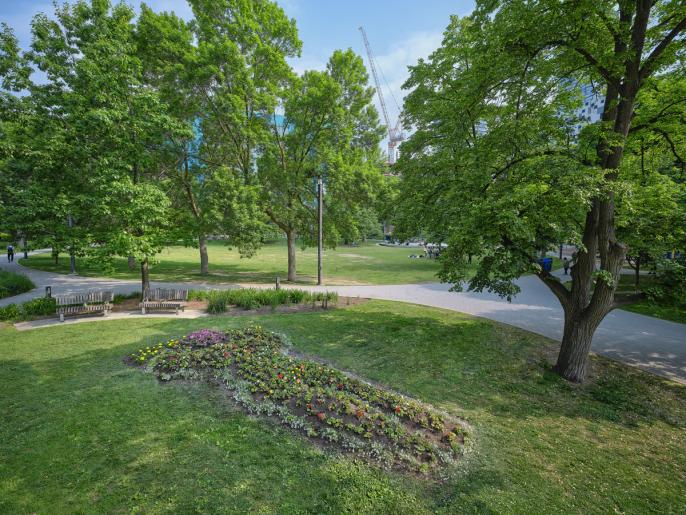 A photograph of a flower bed shaped as the goddess Venus lying on her back