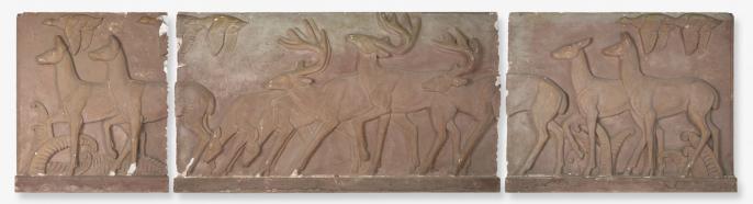 A model of a relief sculpture featuring deer running across a field