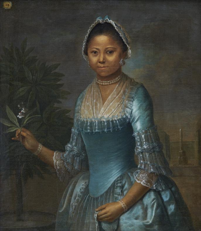An image of the portrait of Eleonora Susette. She is wearing a blue silk gown with a  pearl necklace, earrings, and a cap with matching blue ribbon. In one had she holds an orange blossom. In the other hand, she holds the apron of her skirt.