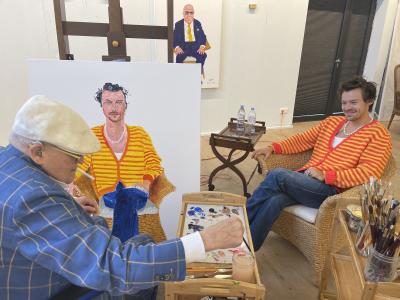 David Hockney painting a portrait of Harry Styles in his studio