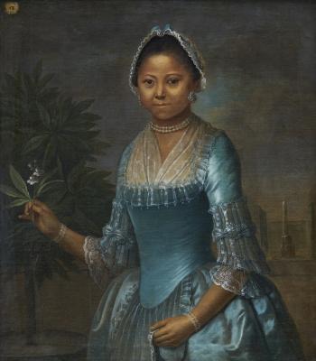 An image of the portrait of Eleonora Susette. She is wearing a blue silk gown with a  pearl necklace, earrings, and a cap with matching blue ribbon. In one had she holds an orange blossom. In the other hand, she holds the apron of her skirt.