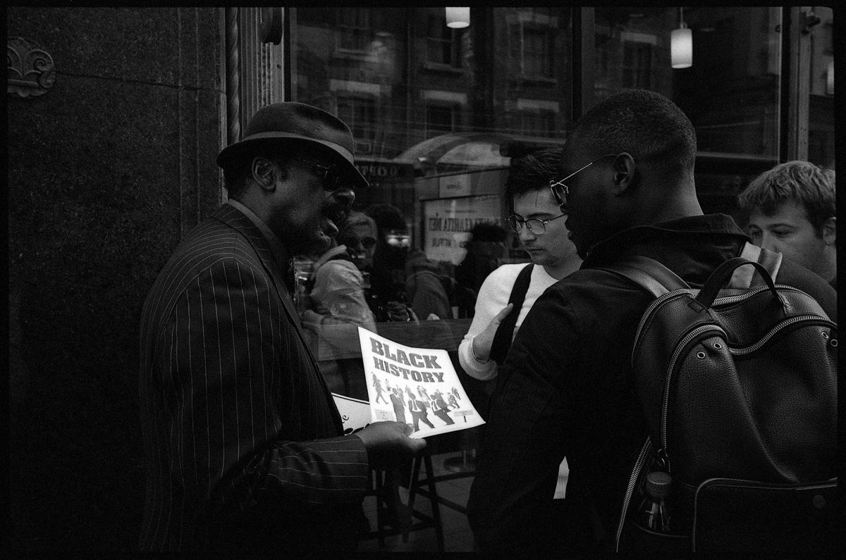 Bidemi Oloyede, An Activist Educating People On A Street Corner.