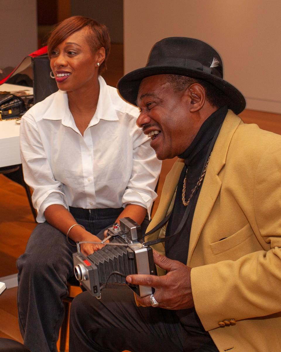 Prince Robinson seated with his daughter Jeanette Robinson-Daley.