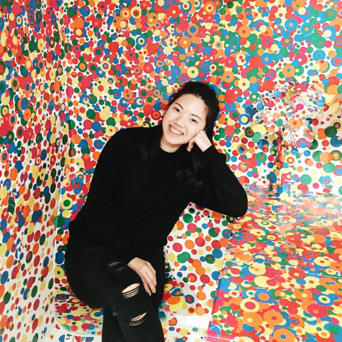 Headshot of artist Lily Koa, surrounded by multicoloured dots