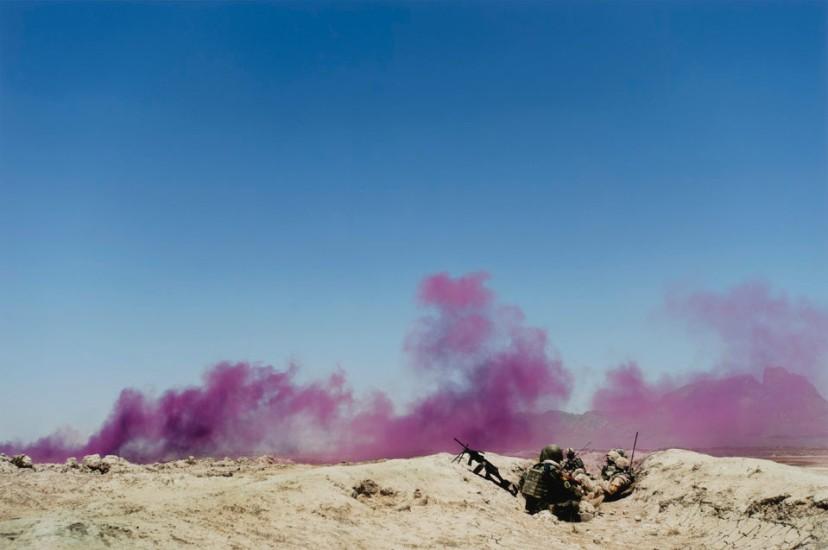 Louie Palu, Afghan and Canadian soldiers in a trench mark their position with purple smoke during a drone strike on insurgents nearby, Panjwa’i District, Kandahar, Afghanistan, 2010.