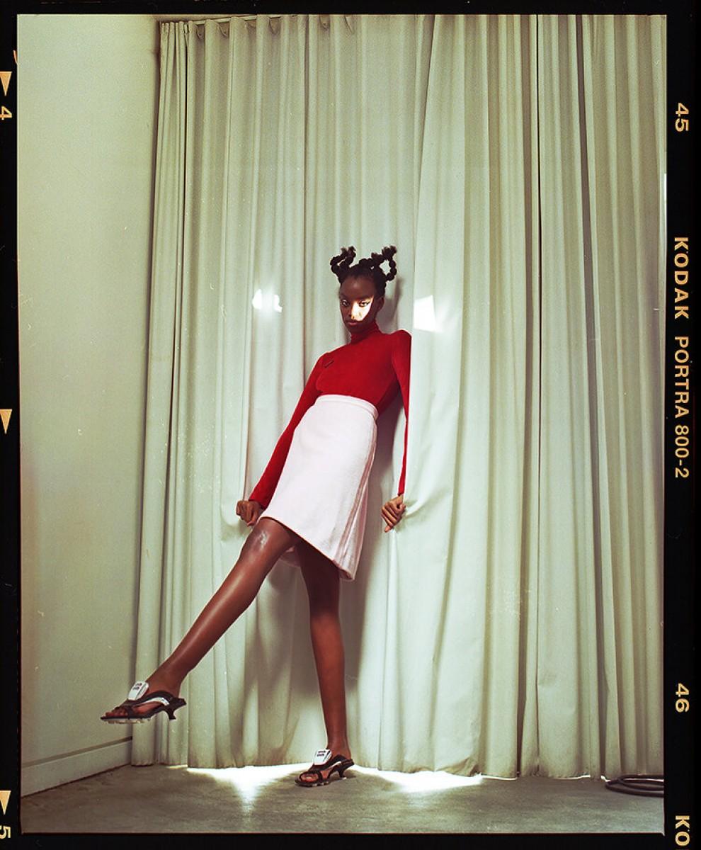 A photo of a young woman posing while wearing a fashionable outfit.