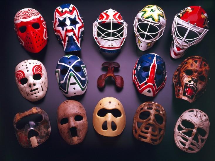 A collection of goalie masks