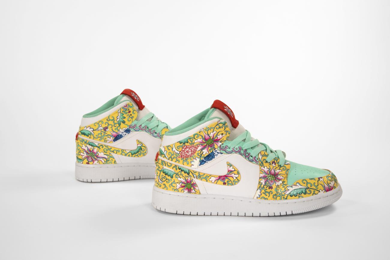 An image of nike Air Jordan 1s decorated with a vibrant peony pattern