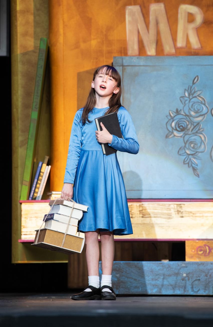 An image of Matilda from Theatre Under the Stars' production of Rohald Dahl's Matilda the Musical