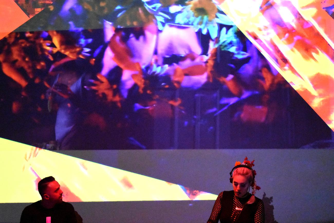 An image of performers TechnoTihuacan on stage during a performance .