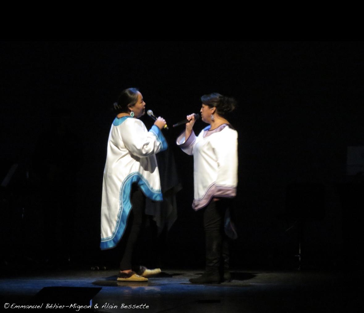 a photograph of Lydia Etok and Nina Segalowitz performing