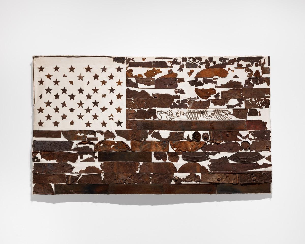 An American flag made with oxidized metal on canvas