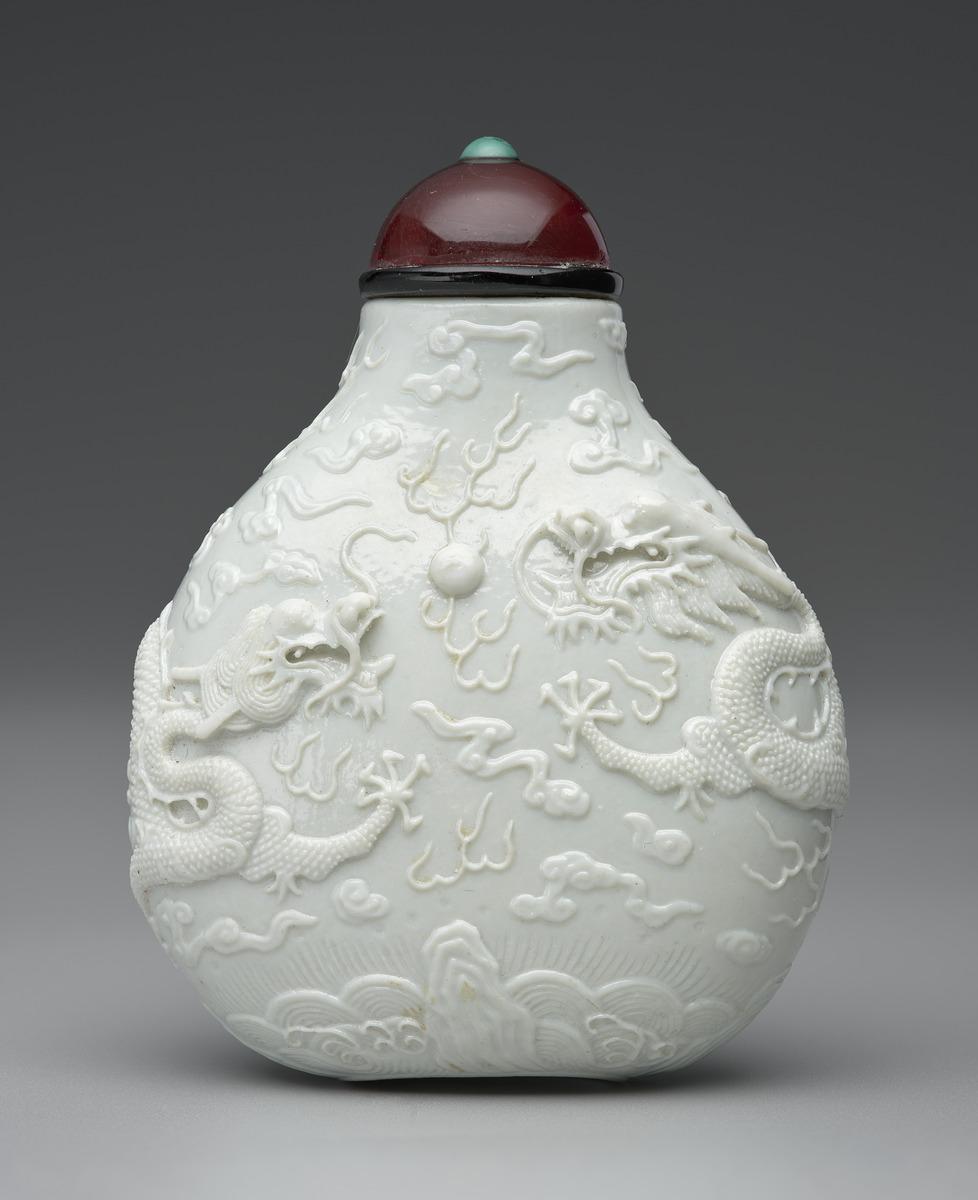 One of a pair in white porcelain with two dragons, porcelain
