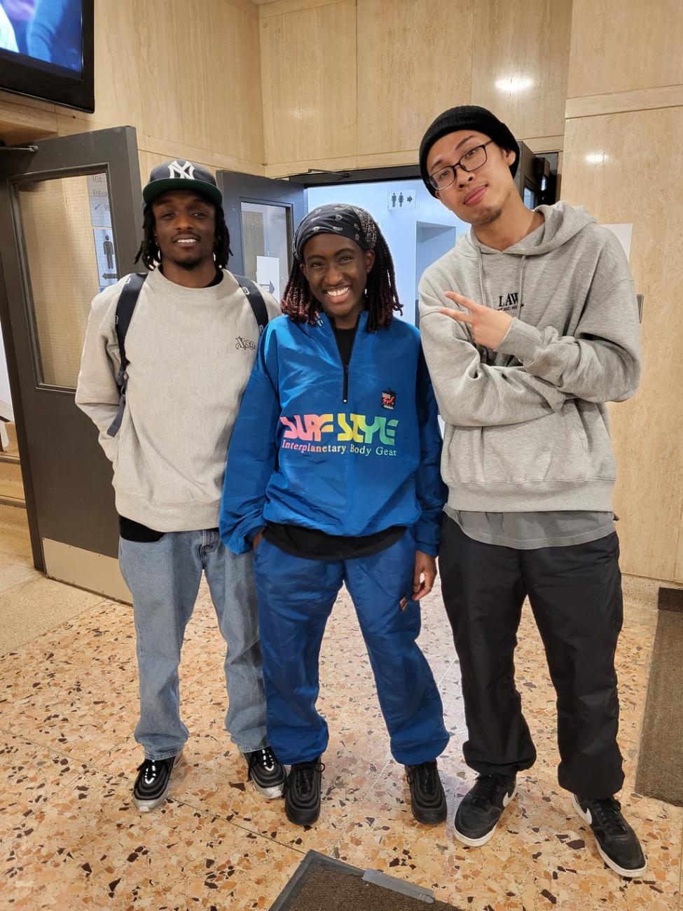 A photograph of members from TBD posing together