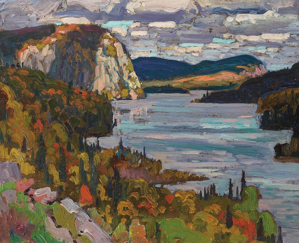 An image of J.E.H. MacDonald's painting Solemn Land, Algoma, which features a few of a lake bordered by trees and a mountain