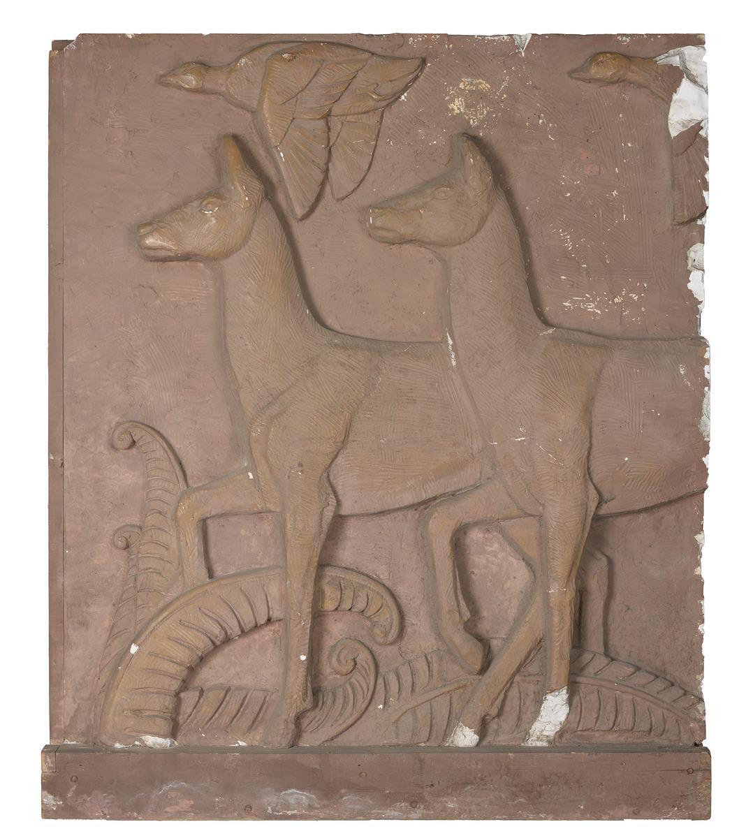 A model of a relief sculpture featuring deer running across a field