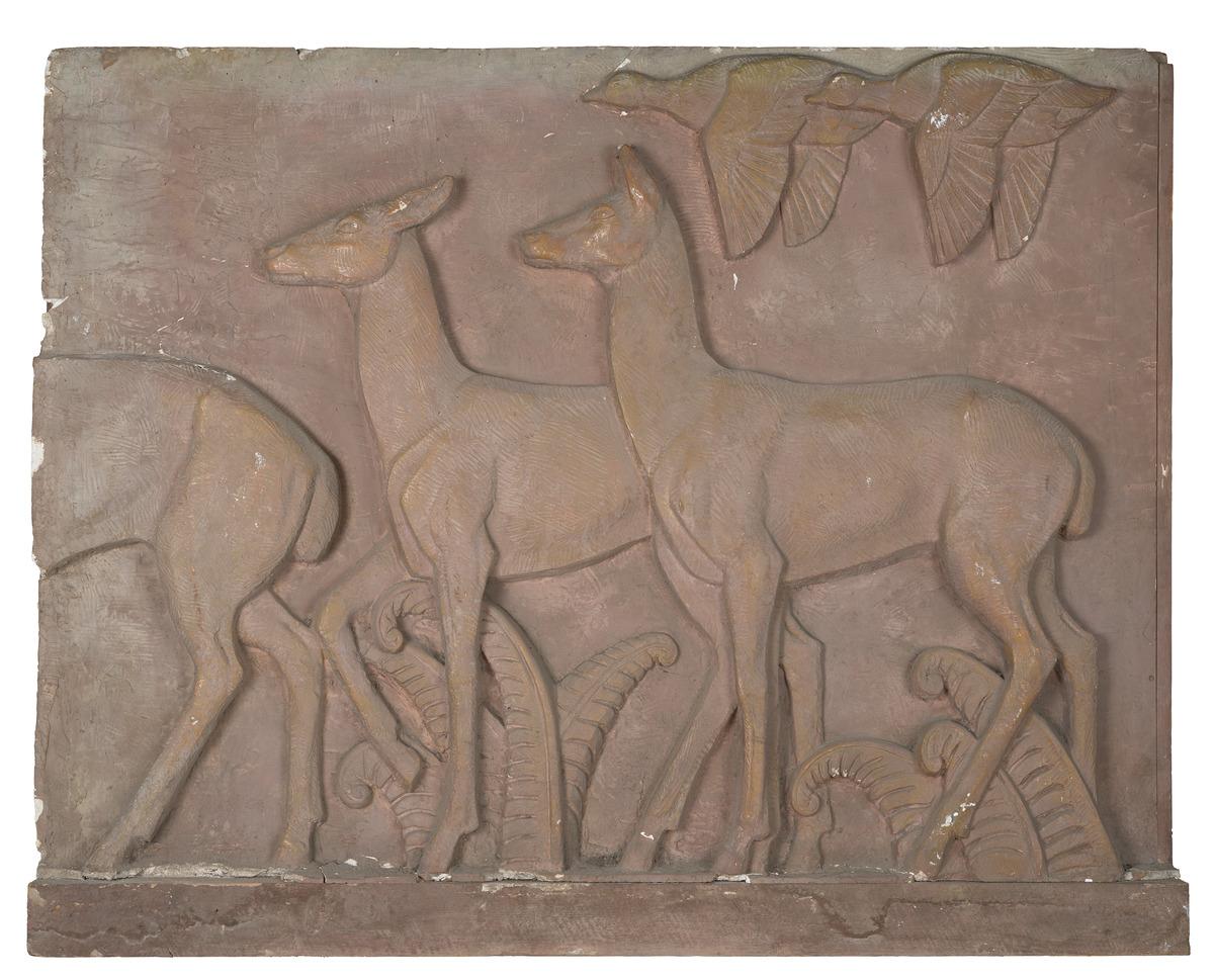 A model of a relief sculpture featuring deer running across a field