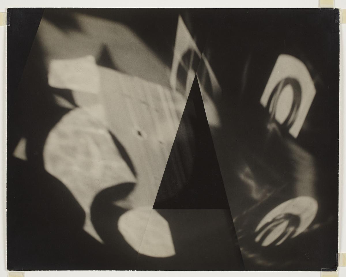 A black and white photograph made using paper, reflected light and shadows