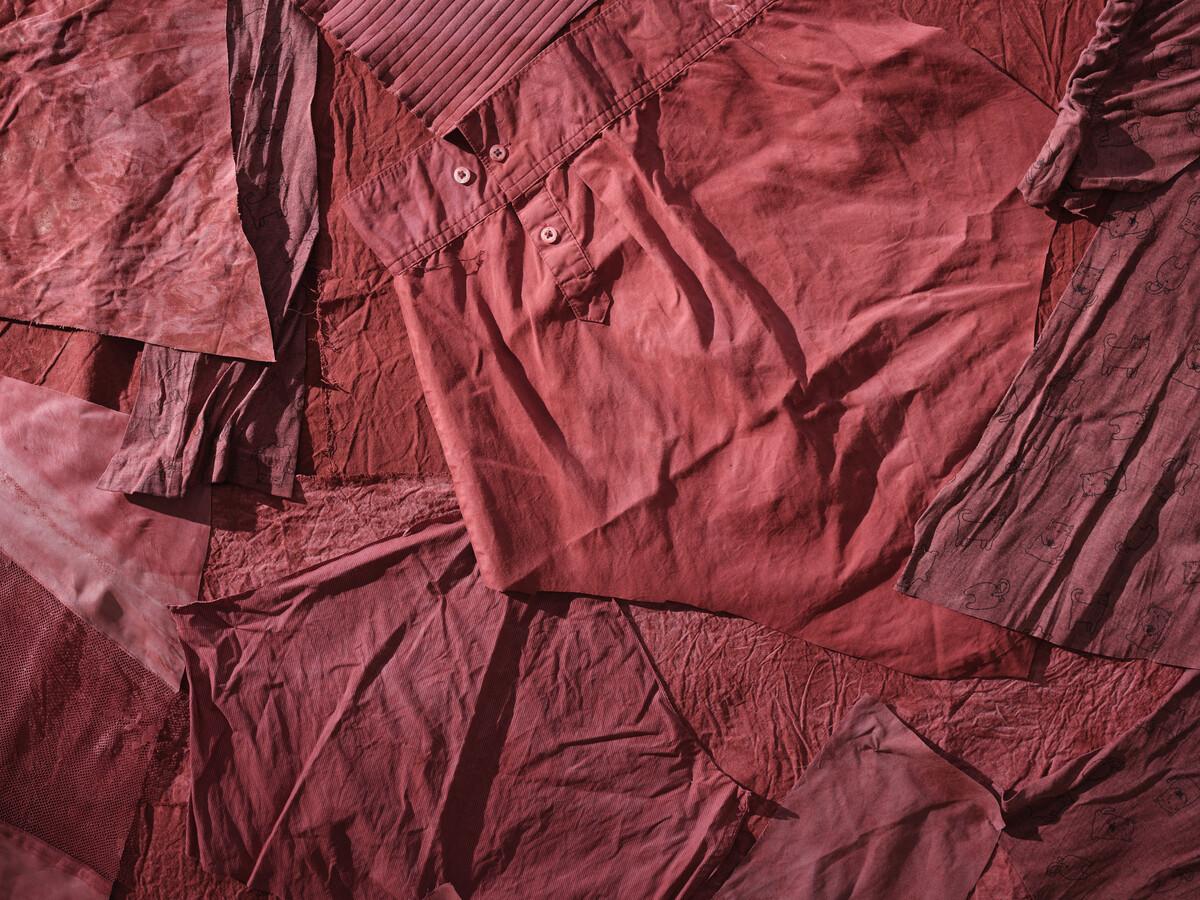 A detail shot of the dyed red clothing on Faye HeavyShield's Venus as Torpedo