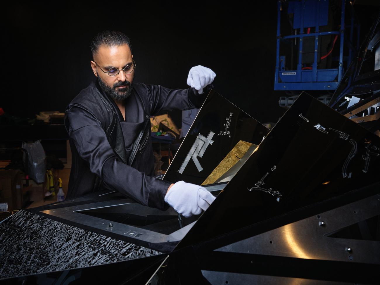 An image of Ranbir Sidhu working on his sculpture Asteroid 3033 X1,