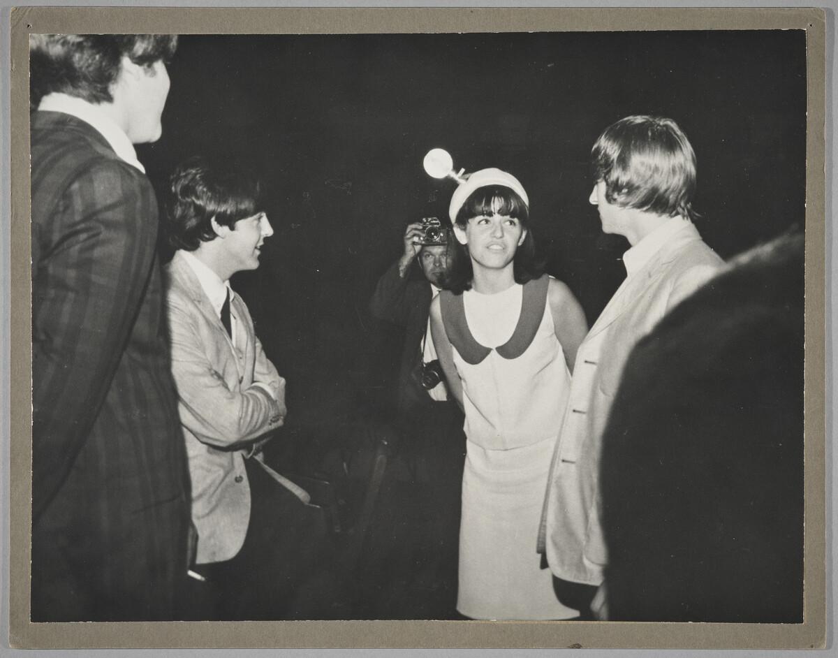A photograph of Trudy talking to the Beatles