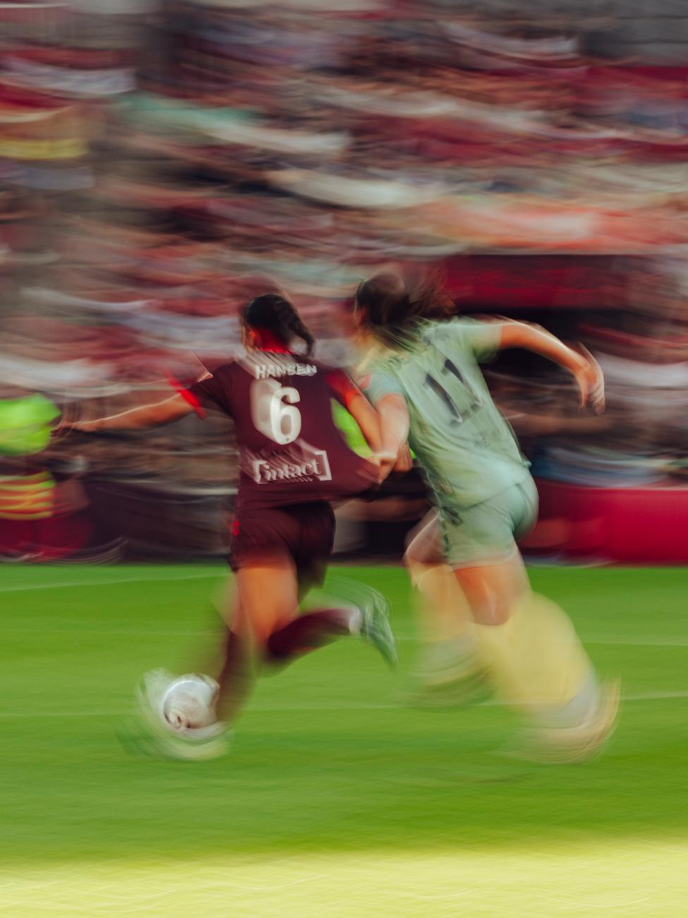 An action photo of Kaela Hansen playing during a soccer match