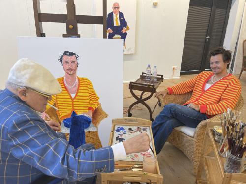 David Hockney painting a portrait of Harry Styles in his studio 